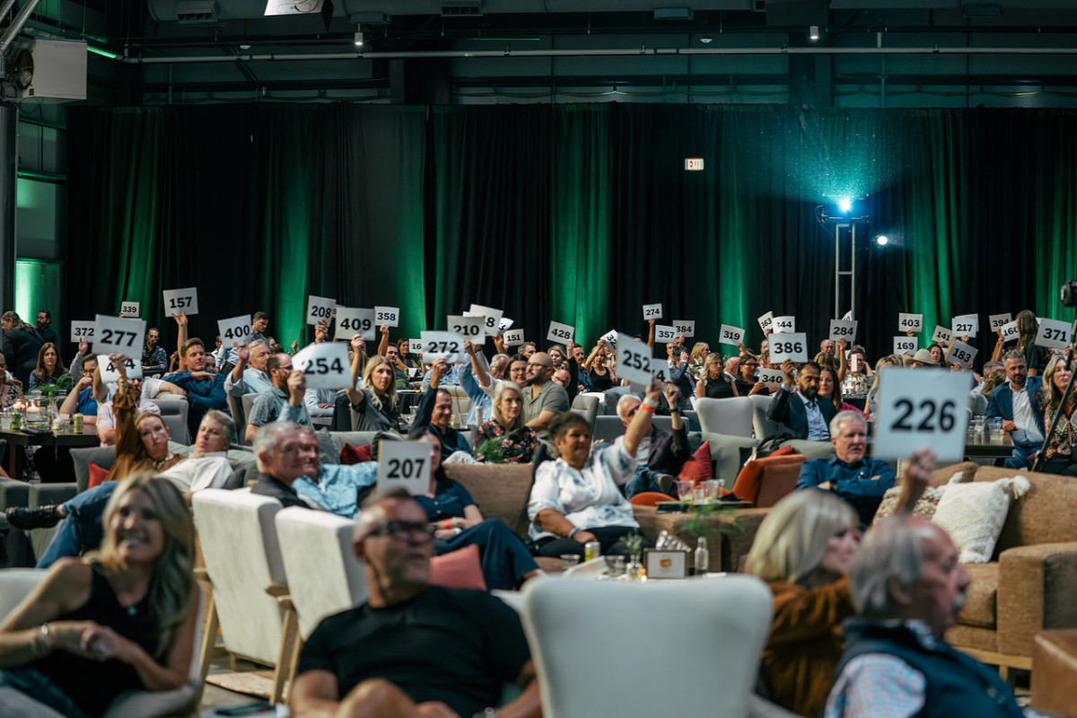 photo of a group of people at the event enjoying themselves at event auction